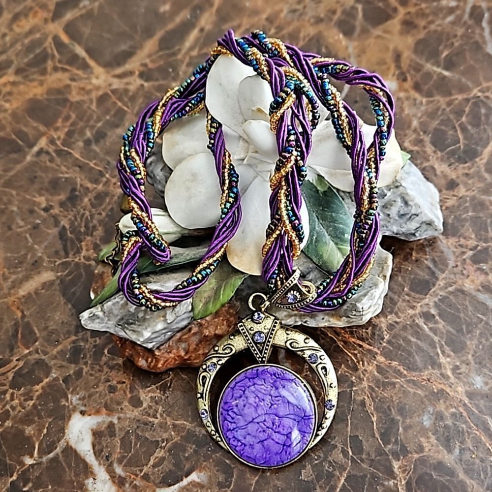 NWOT Braided necklace with large purple stone.